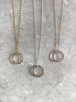 Double Karma Necklace: available in silver, gold, and rose gold.