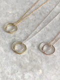 Double Karma Necklace: available in silver, gold, and rose gold.